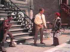 Pat Boone asks a local where he can find Elvis and Robert Foxworth.