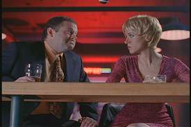 It's hard to tell, due to the magic wig and all, but Bako's the one on the right.  (Note the microphone popping into the shot.)