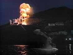 ...resulting in the nearby oil refinery (?!) dramatically exploding.