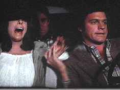 Actor Collins projects abject terror (as does Ben in the backseat) as his character faces an imminent, horrible death in a car crash.